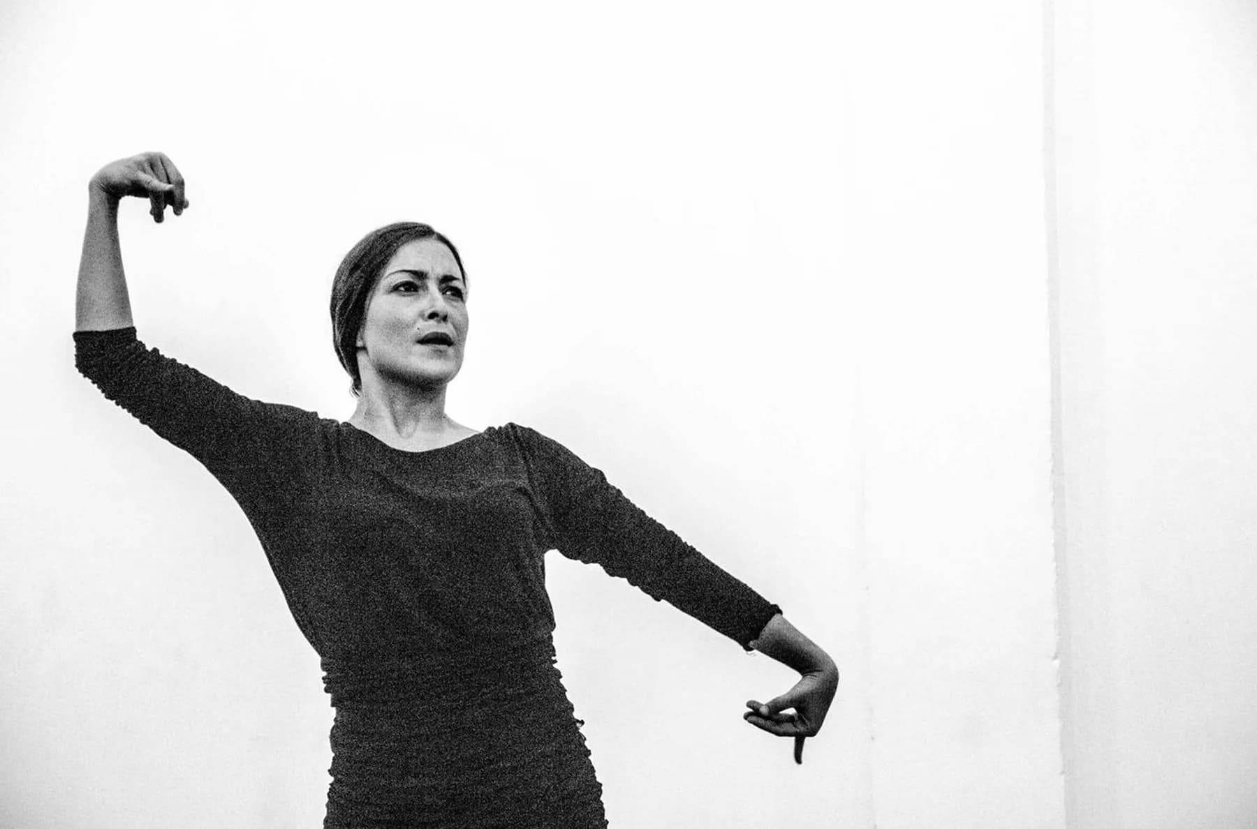 A flamenco dancer mid-performance in Seville